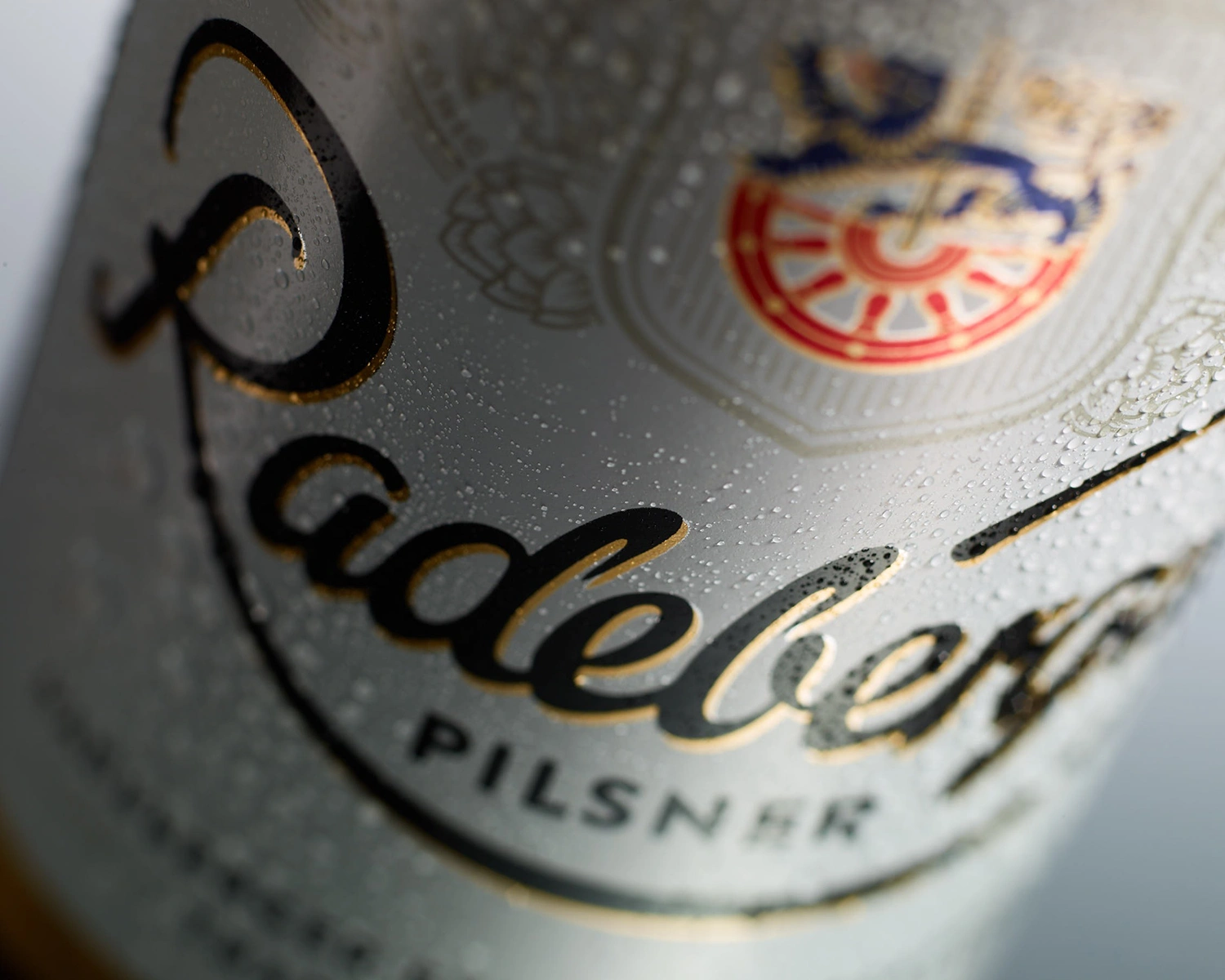 Condensation forms on the label of a bottle of Radeberger Pilsner beer.