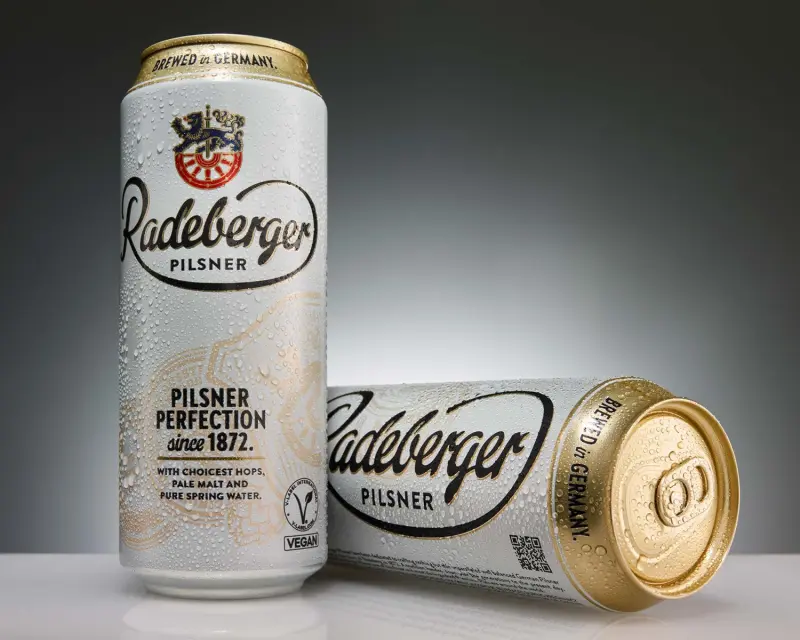 Next to a Radeberger beer cans is a Radeberger Zwickel beer can.