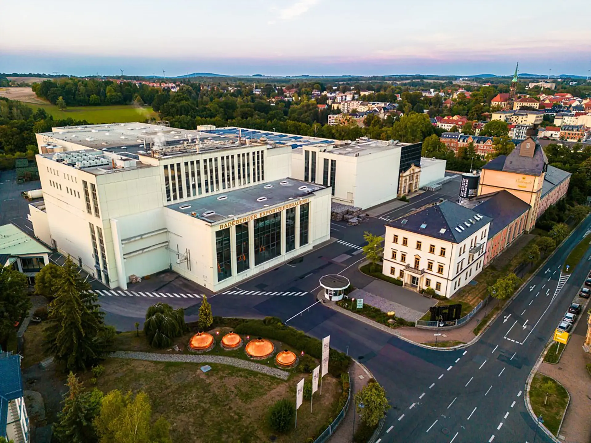 A large building with the words Radeberger Exportbierbrauerei written on it.