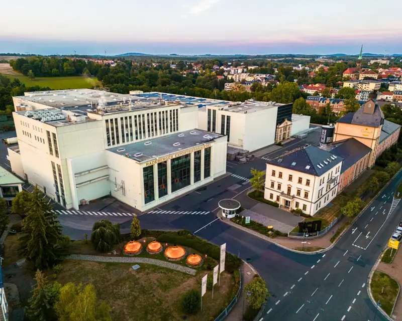 A large building with the words Radeberger Exportbierbrauerei written on it.